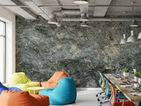 Textured Rock wallpaper mural in grey stone in an open office lounge with colourful bean bags and a laptop desk