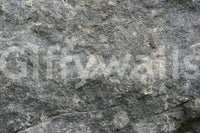 Textured Rock wallpaper mural close-up showing the speckled grey-green granite surface with fine cracks