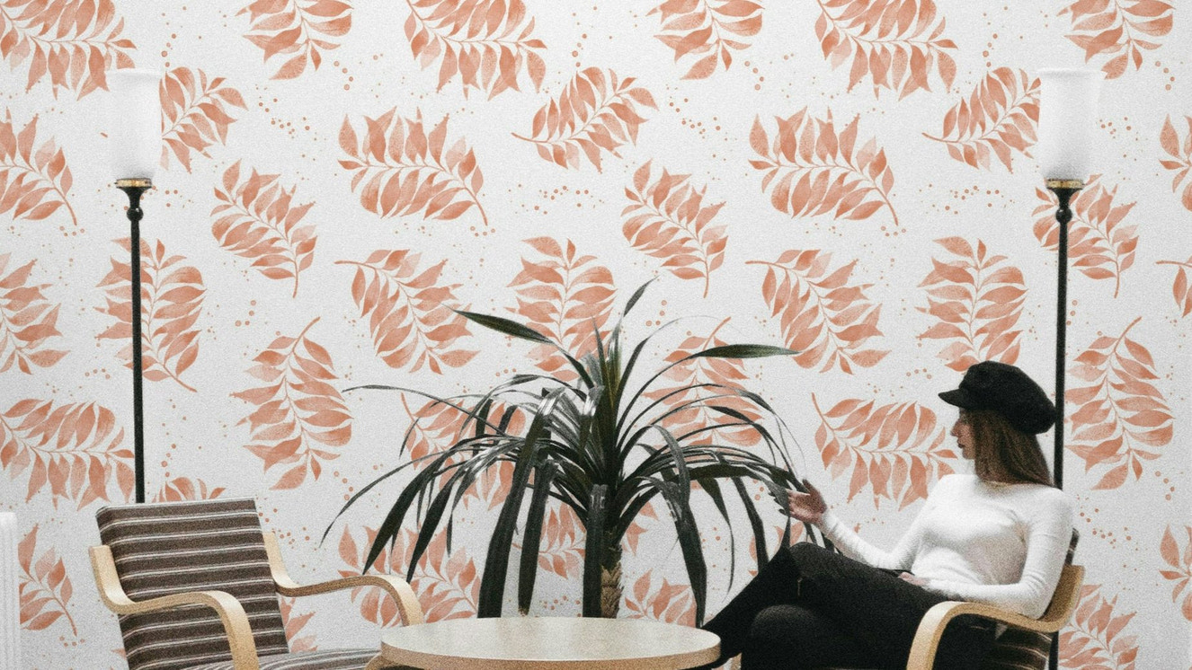 Textured watercolor palm leaf wallpaper in terracotta

