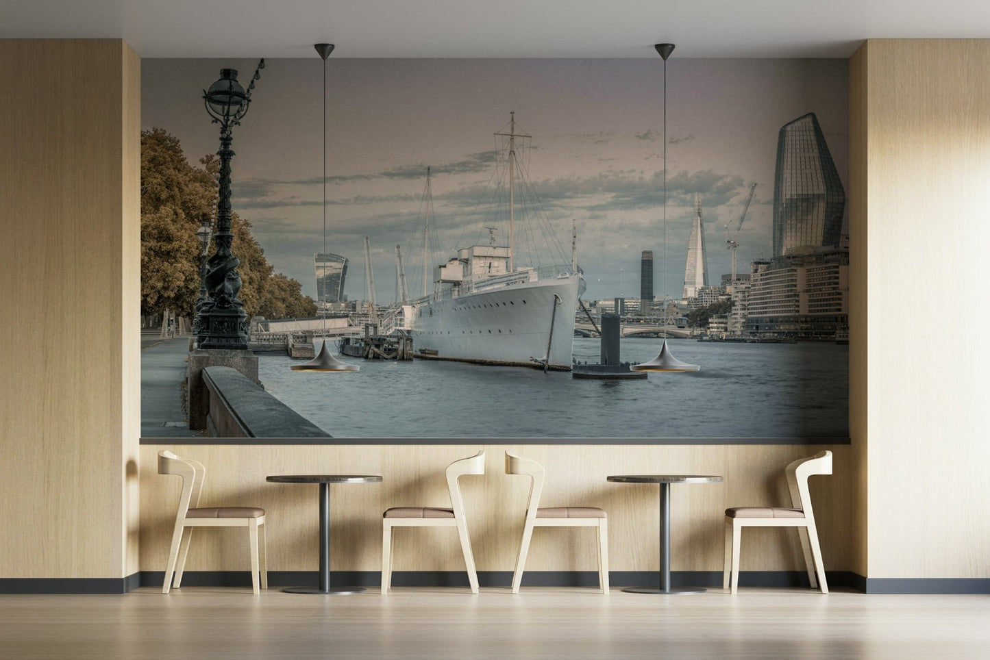 View of the Thames from a riverbank promenade.


