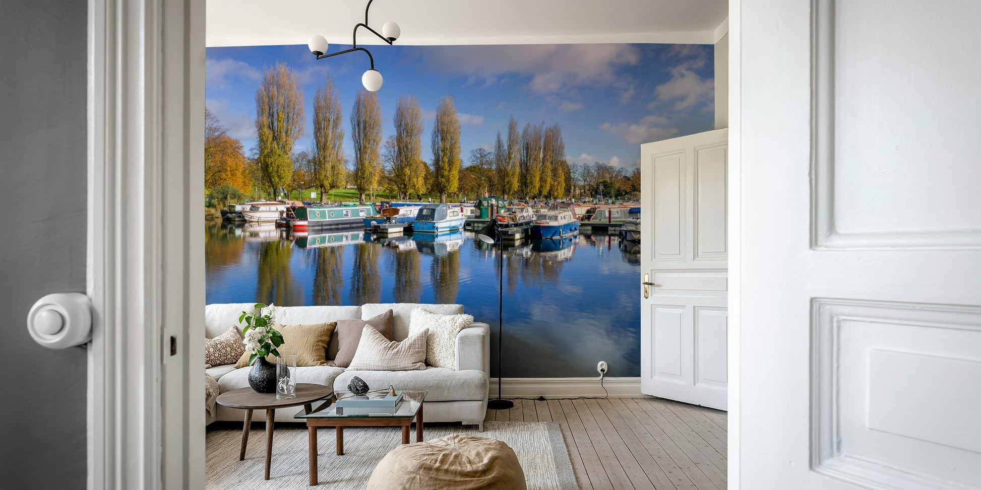 Autumn trees and moored boats in a tranquil marina mural

