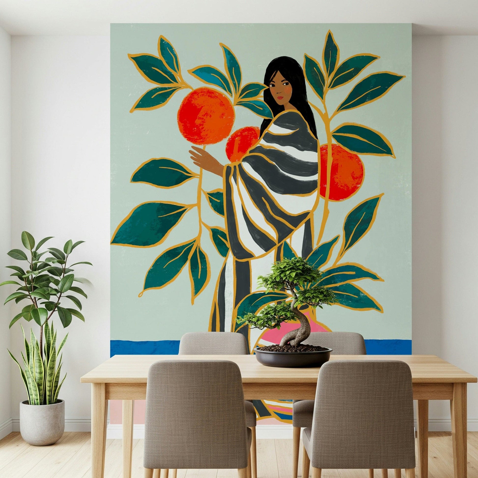 The Keeper of Oranges wallpaper mural of a woman by an orange tree behind a wood dining table with taupe chairs