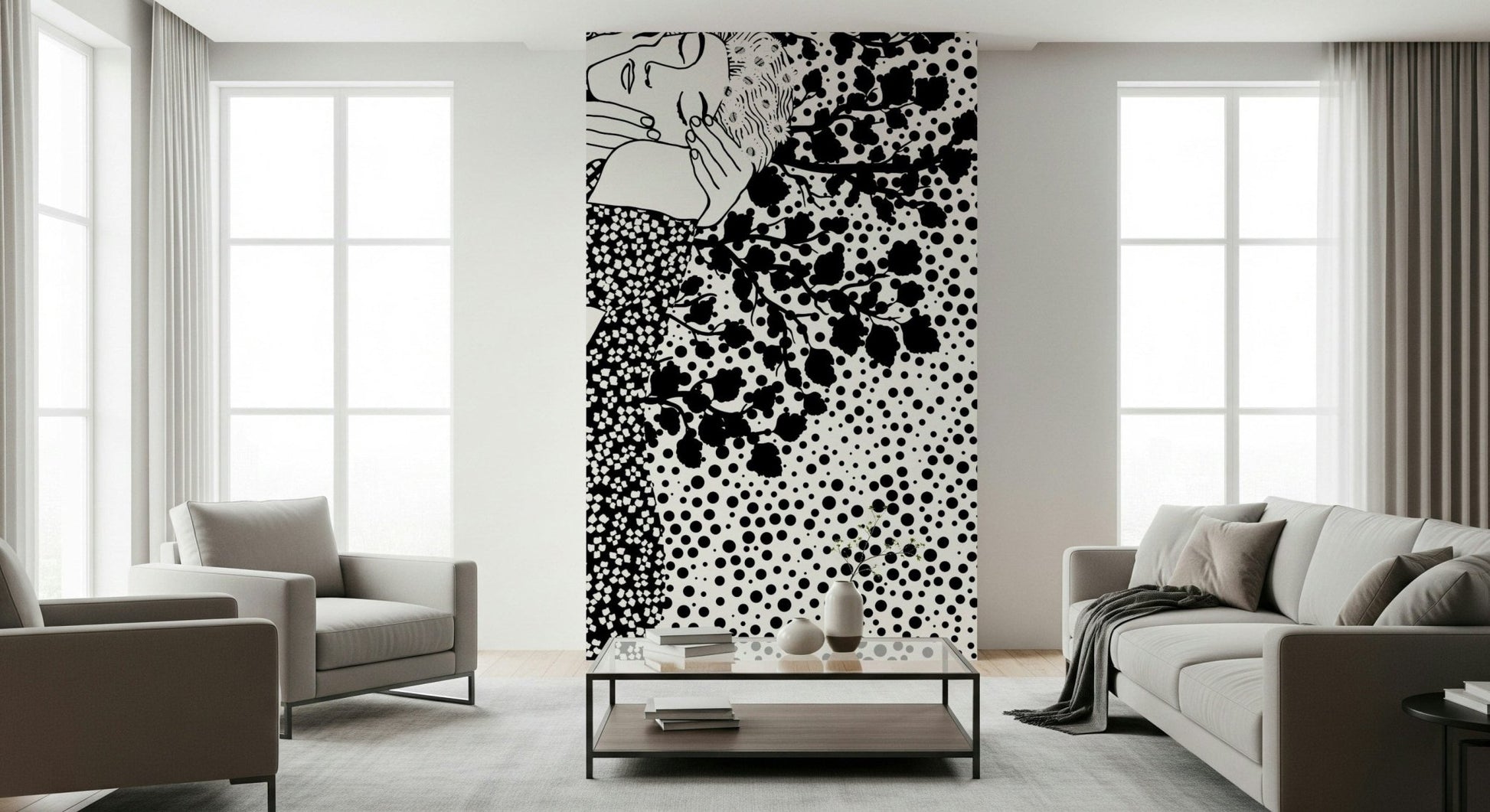 The Kiss II wallpaper mural in black and white of an embracing couple behind a grey sofa and armchairs