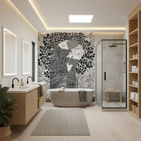 The Kiss II wallpaper mural of a black and white embracing couple behind a freestanding tub and glass shower