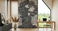 The Kiss II wallpaper mural of a monochrome embracing couple behind a wood desk by a large window
