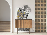 The Kiss wallpaper mural of a kissing couple above a fluted wood sideboard in an entryway