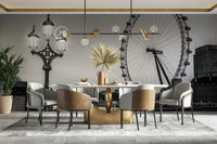 A large wheel is placed alongside the lamp.

