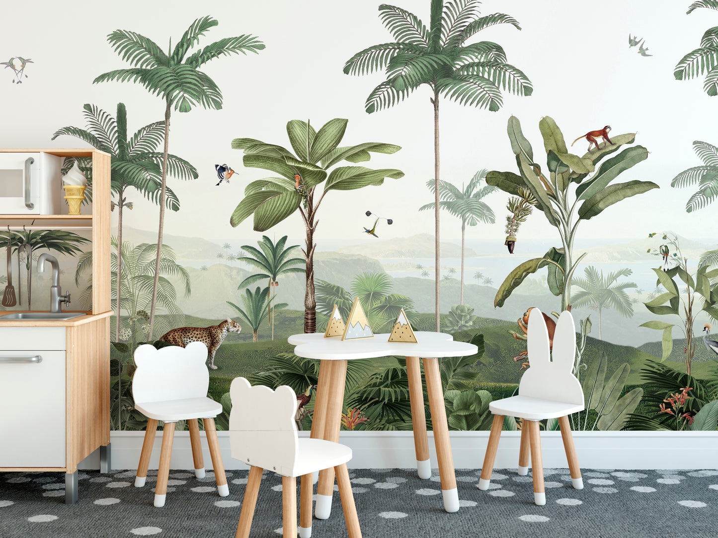 Thrilling Tropics wallpaper mural of tropical palms and monkeys behind a kids table and bear-shaped chairs