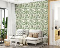 Timeless Garden Sage Green wallpaper of sage damask behind a white sofa with grey and tan throw pillows