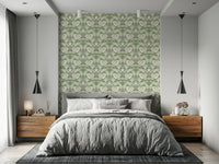 Timeless Garden Sage Green wallpaper of green and cream florals behind a grey bed in a calm modern bedroom