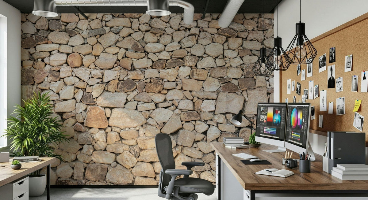 Timeless Stonework wallpaper mural in rounded tan fieldstone behind a desk with dual monitors in a home office