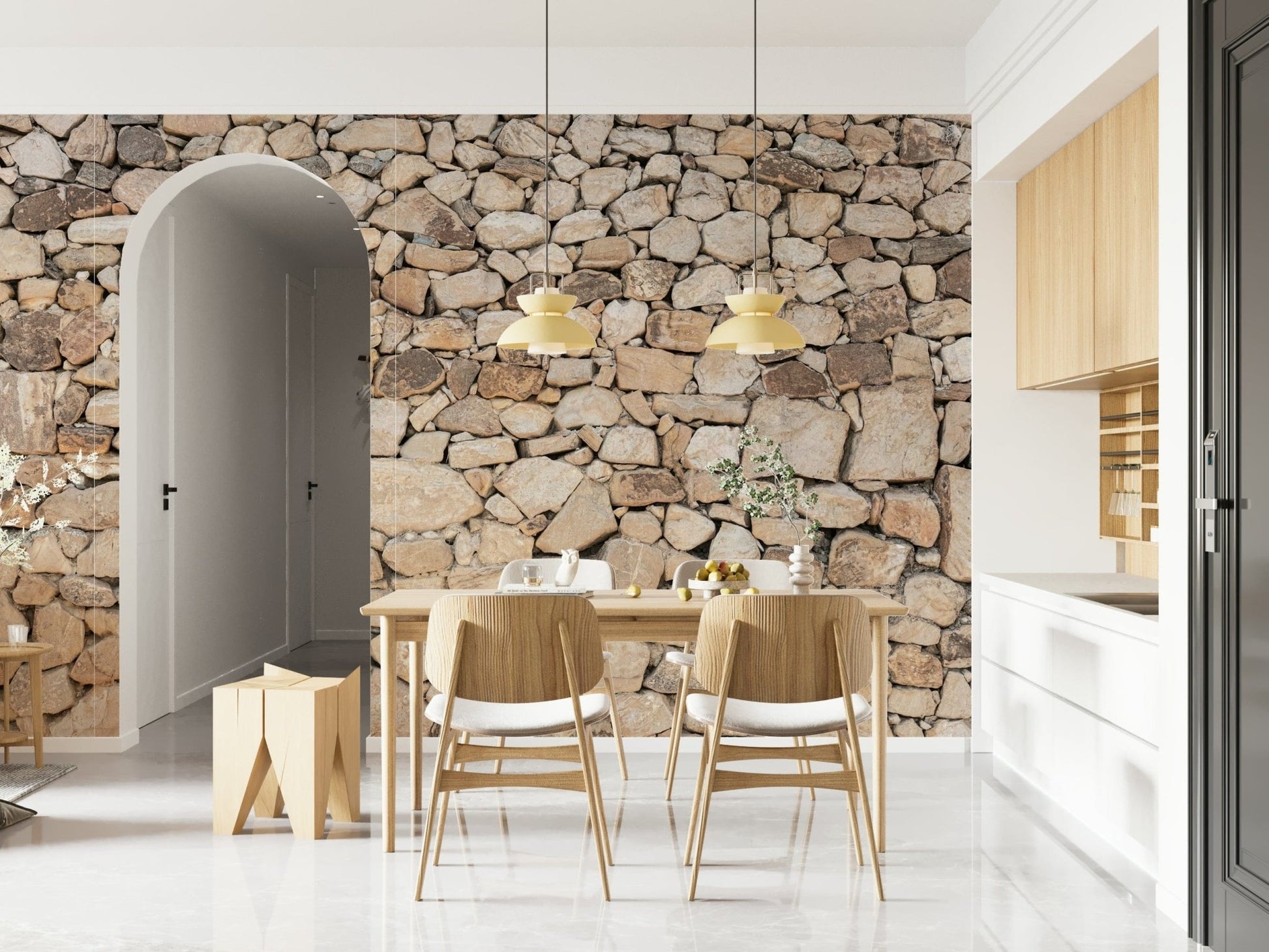 Timeless Stonework wallpaper mural of tan fieldstone behind a wood dining table and chairs near an arched doorway
