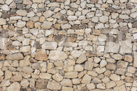 Timeless Stonework wallpaper mural close-up showing tan, cream and grey rounded fieldstone packed in tight mortar