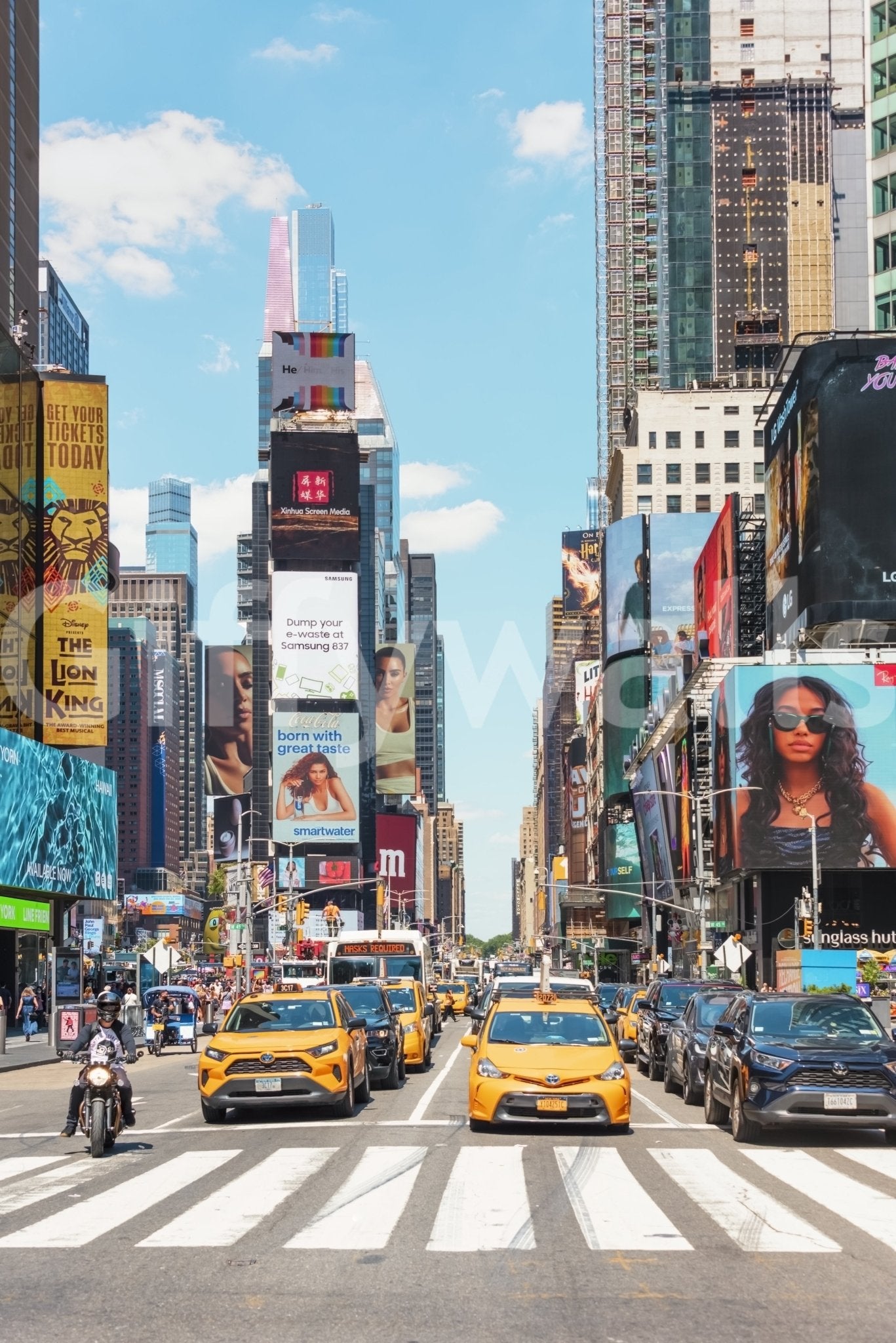 Times Square Buzz wallpaper mural shown full-wall with yellow taxis at the crosswalk under glowing NYC billboards
