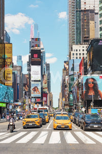 Times Square Buzz wallpaper mural shown full-wall with yellow taxis at the crosswalk under glowing NYC billboards