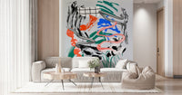 Tornado wall mural of metallic swirls and bright brushstrokes behind a cream sofa and beanbag in a sunny living room