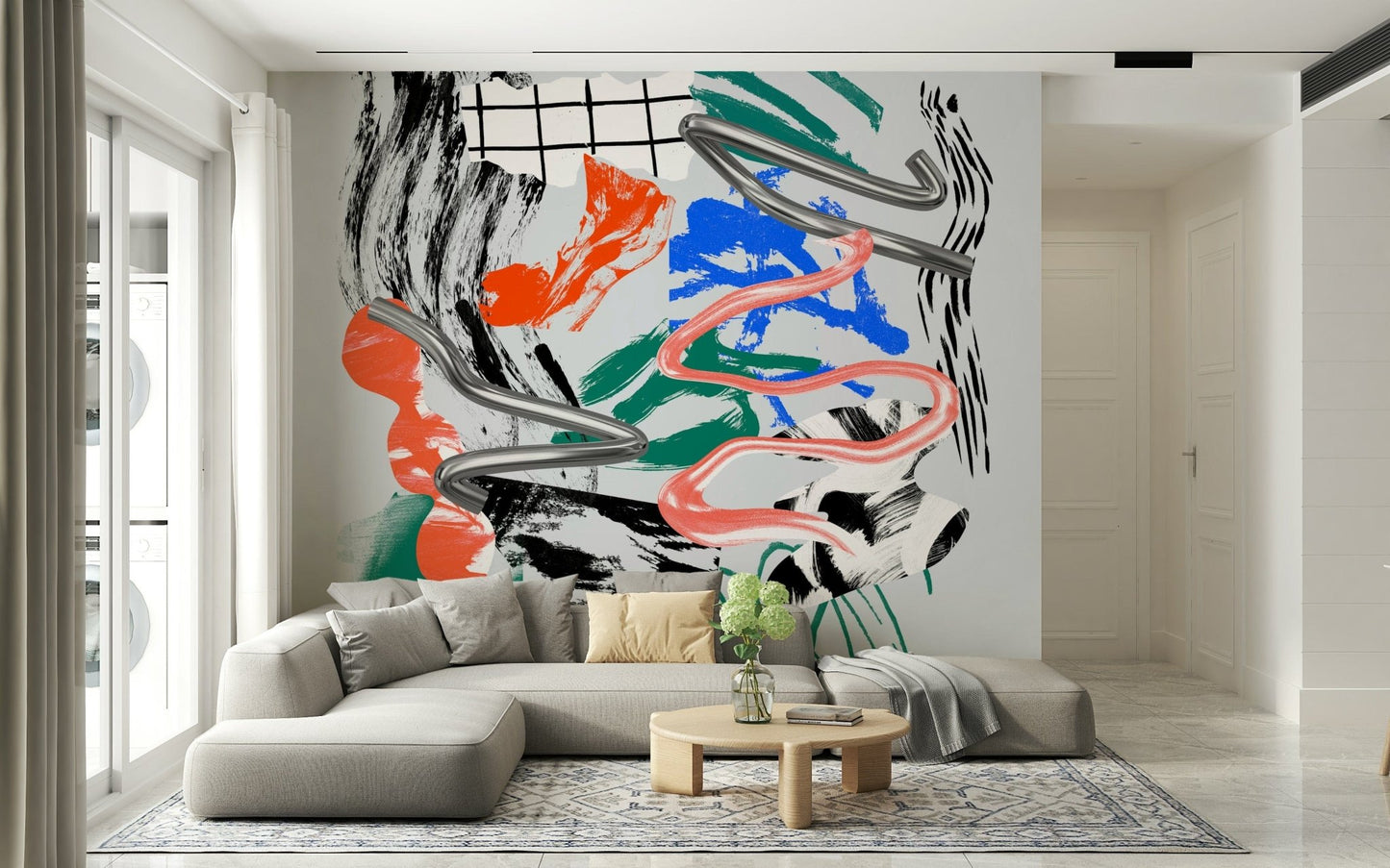 Tornado wall mural with chrome swirls and pink ribbon over colorful brushstrokes behind a gray sectional sofa in a living room