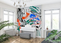 Tornado wall mural of silver swirls and colorful strokes above a white upright piano in a bright music room