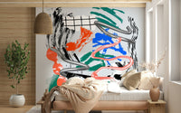 Tornado wall mural of silver swirls and bright brushstrokes above a bed with a striped throw in a cozy bedroom