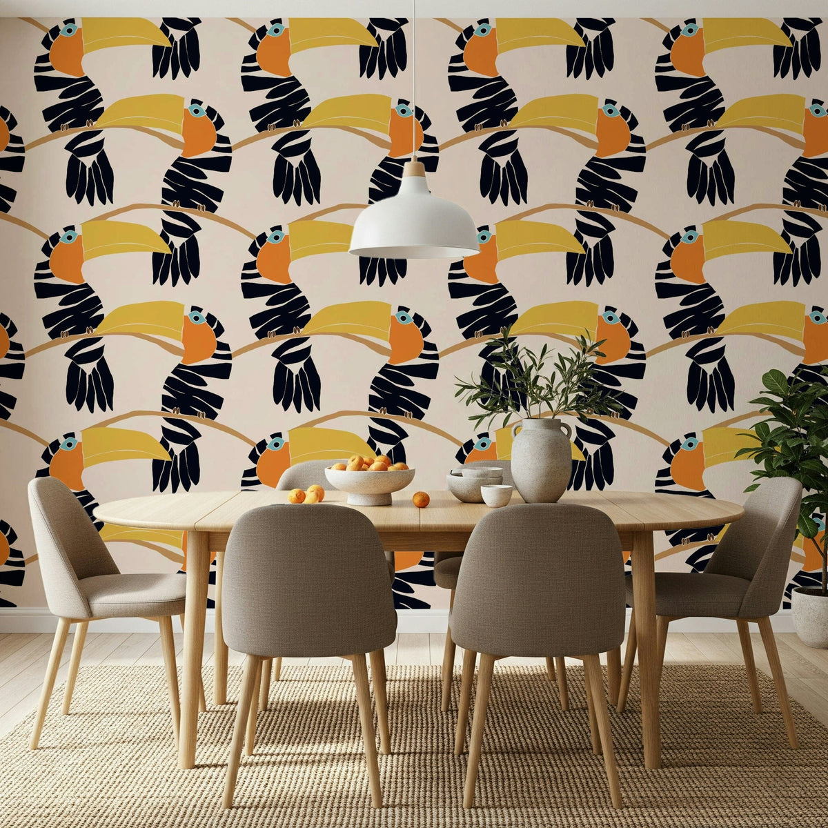 Toucans on Parade wallpaper of navy toucans on branches behind an oval wood dining table
