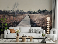 Trail's End Serenity Wall Mural behind a gray sofa in a bright urban apartment.