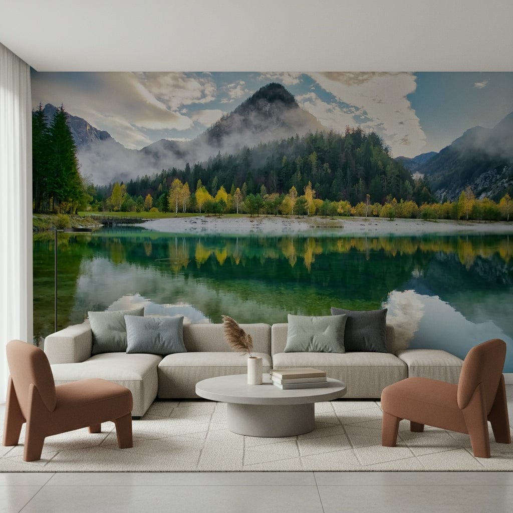Alpine Reflection wallpaper mural of an emerald lake mirroring a misty forested peak behind a cream sofa and terracotta chairs in a living room