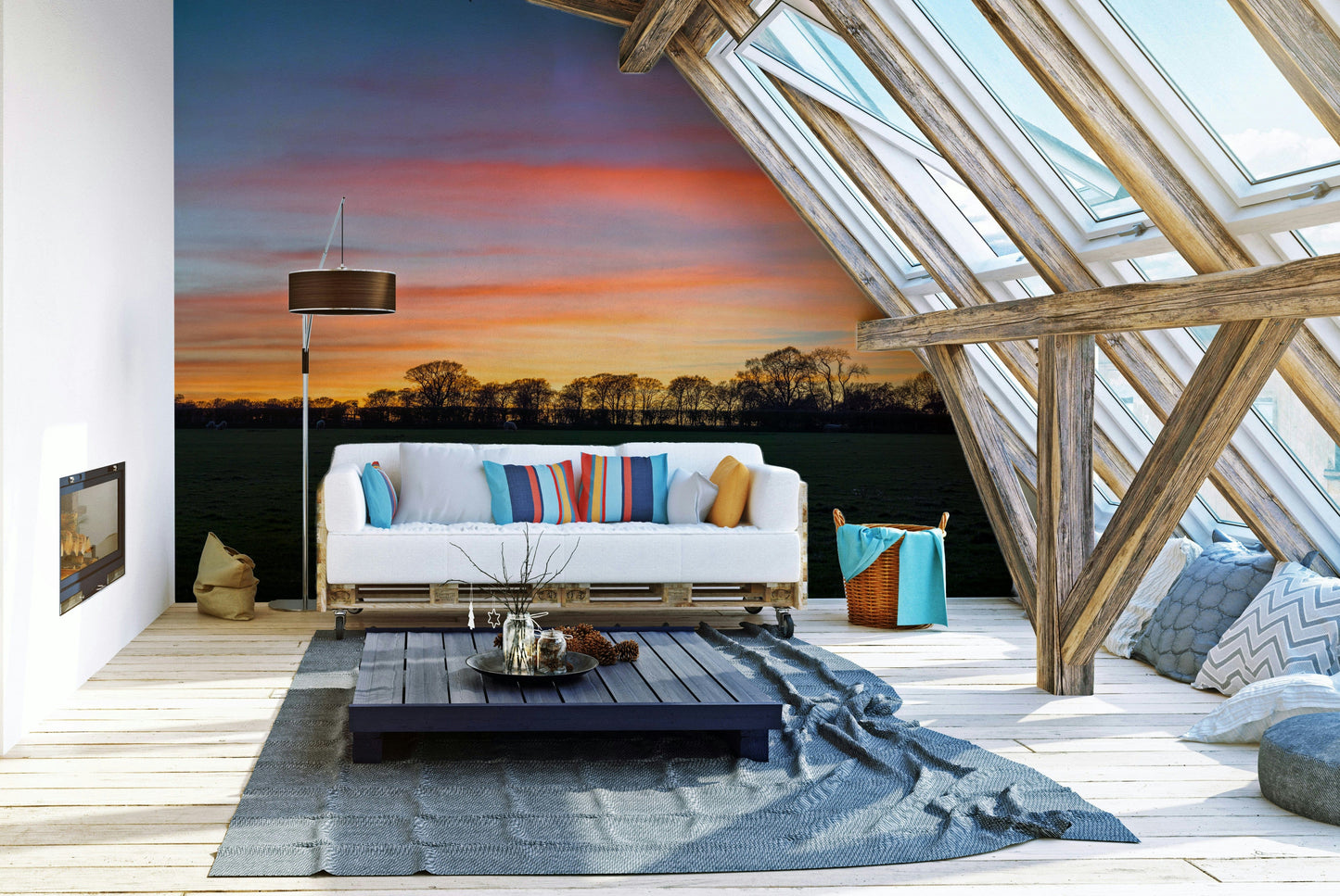 Serenity in Shadows wallpaper mural of a dusk countryside behind a white pallet sofa in a sunlit attic lounge