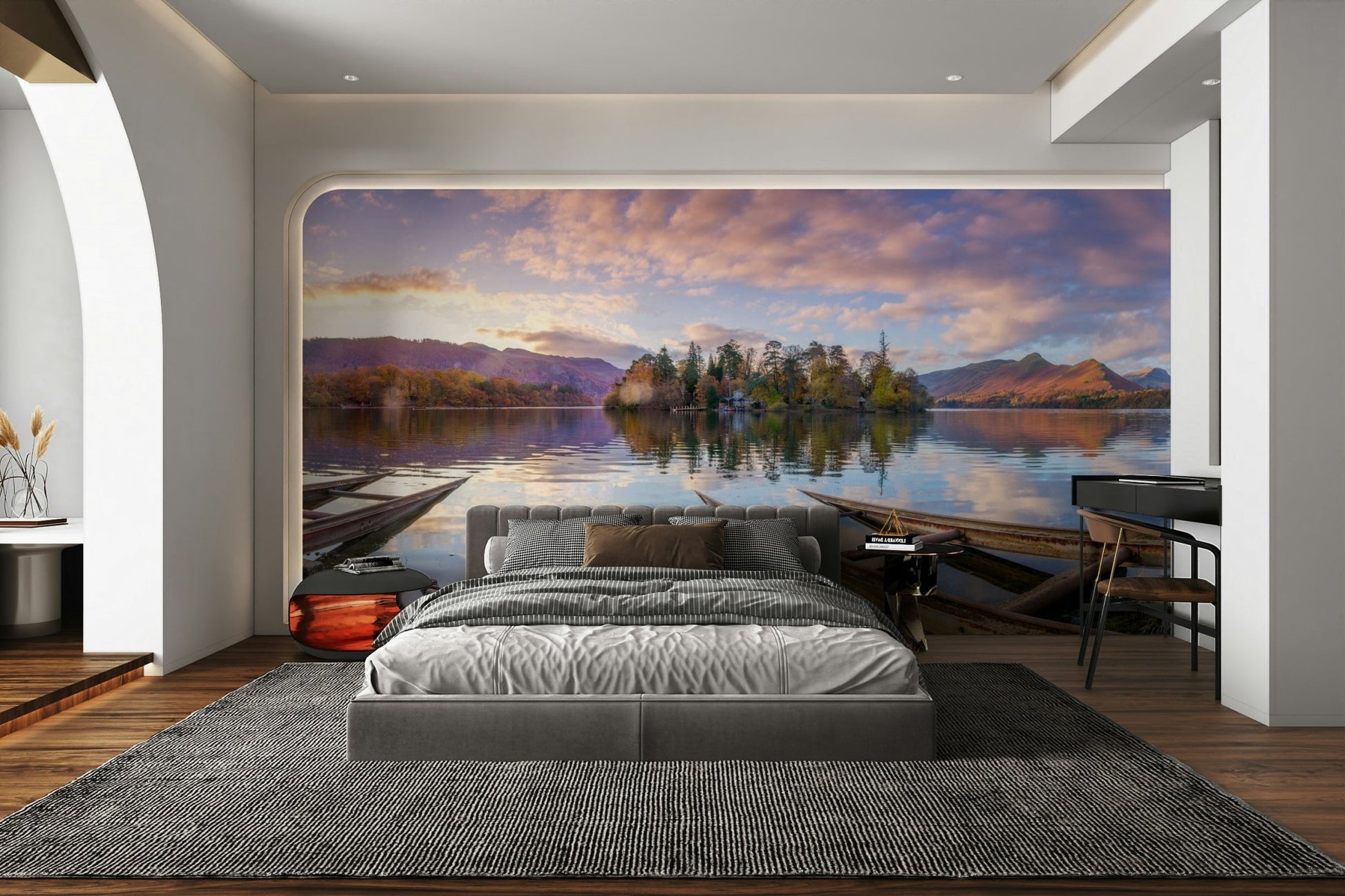 The surrounding trees and mountains are reflected in the water.

