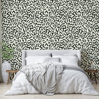 Hand Drawn Abstract Tribal Wallpaper on a living room wall

