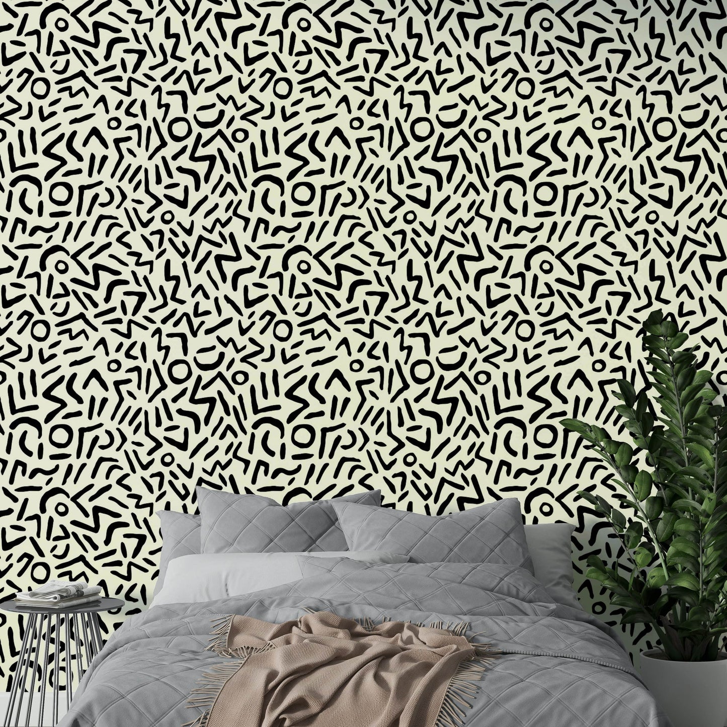 A bedroom decorated with an abstract wall mural

