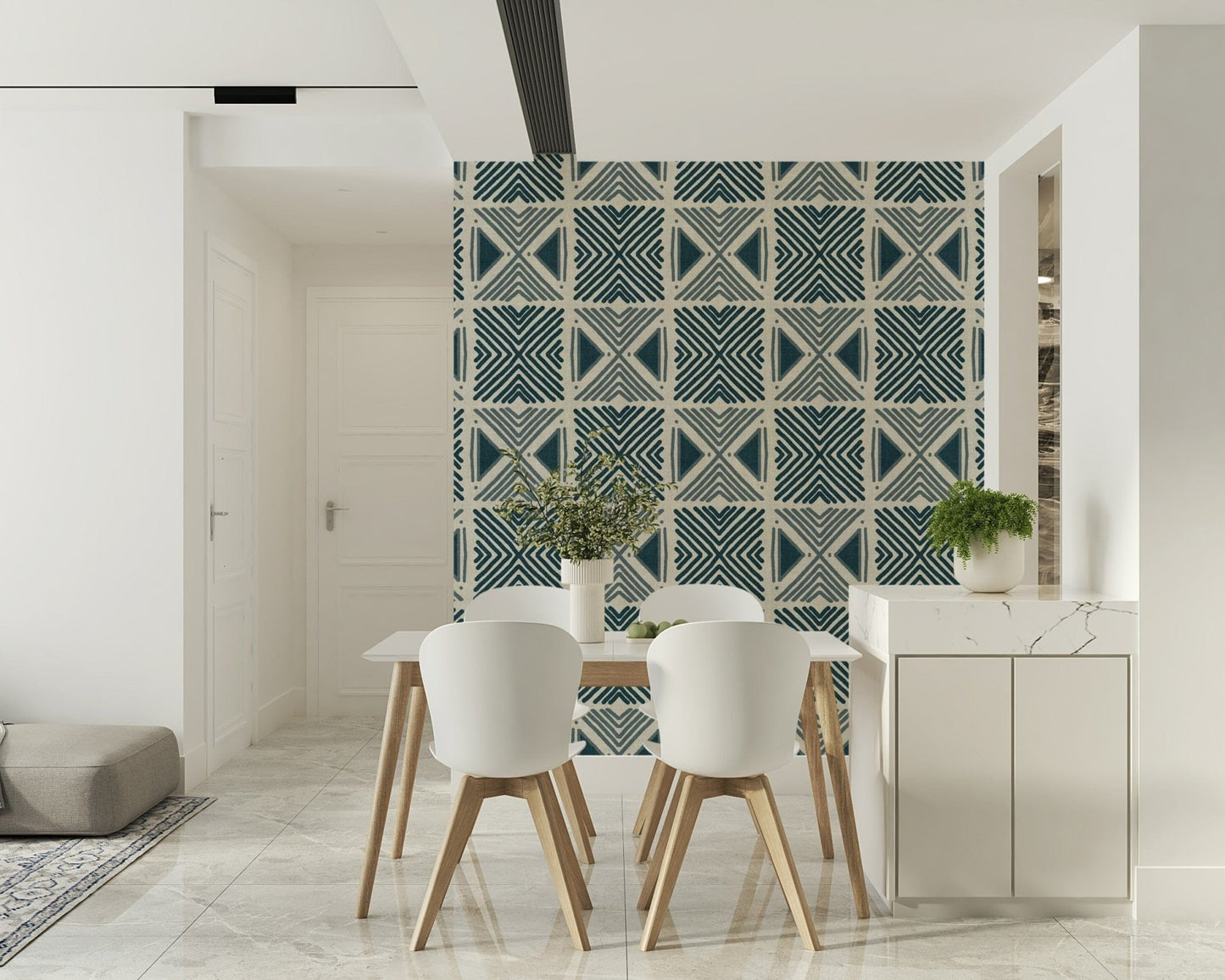 Indigo pattern mural for a nursery with white wooden furniture and neutral tones.