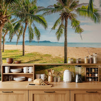 Coastal wall mural anchors warm wooden dining space