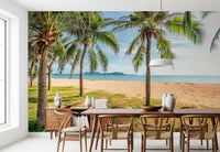 Sunset beach wall mural defines cafe seating area