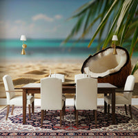 Minimalist palm leaf pattern wallpaper in a laundry room with clean white shelving.