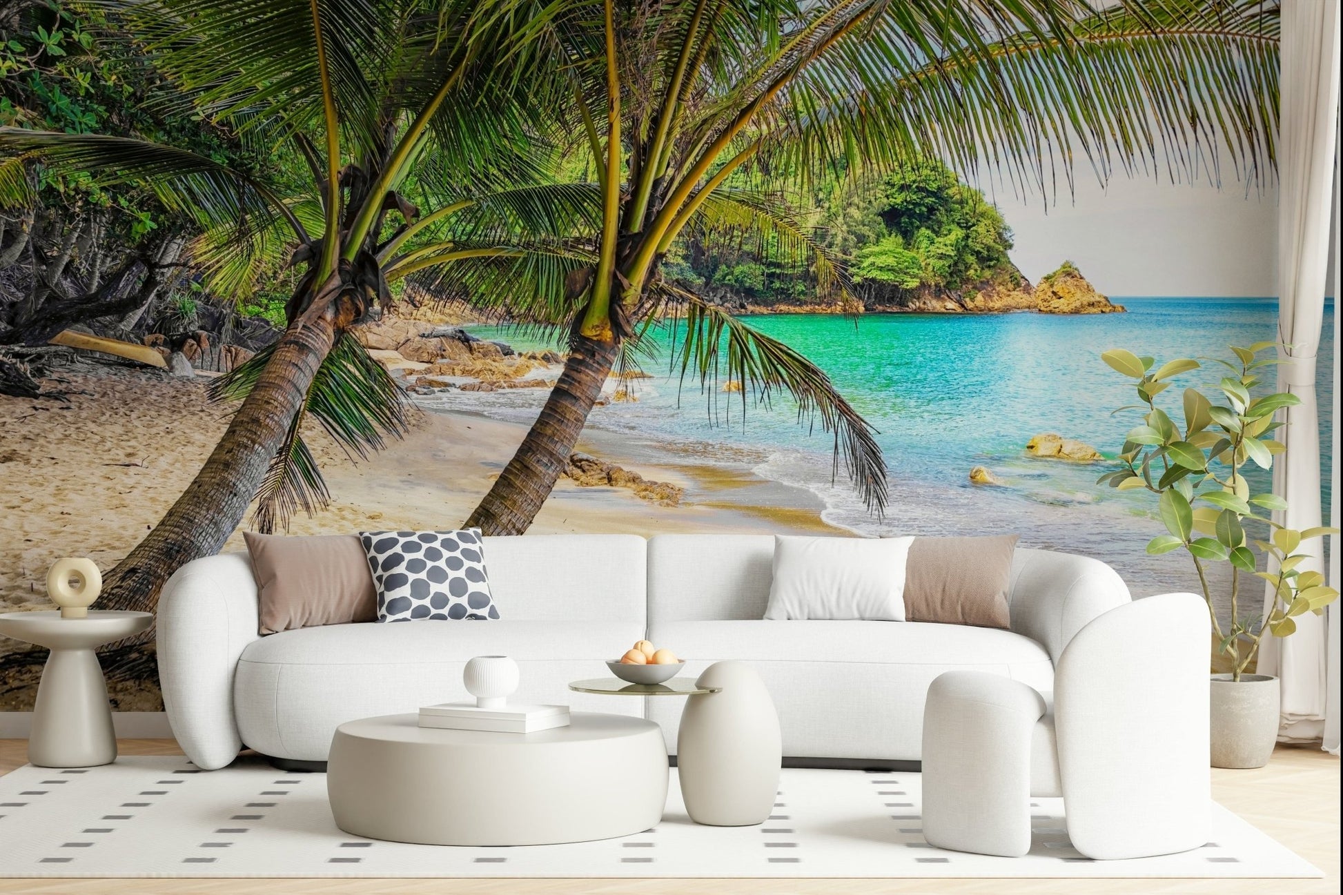 Tropical Beach Escape wallpaper mural of a palm-fringed cove behind a white curved sofa and round tables