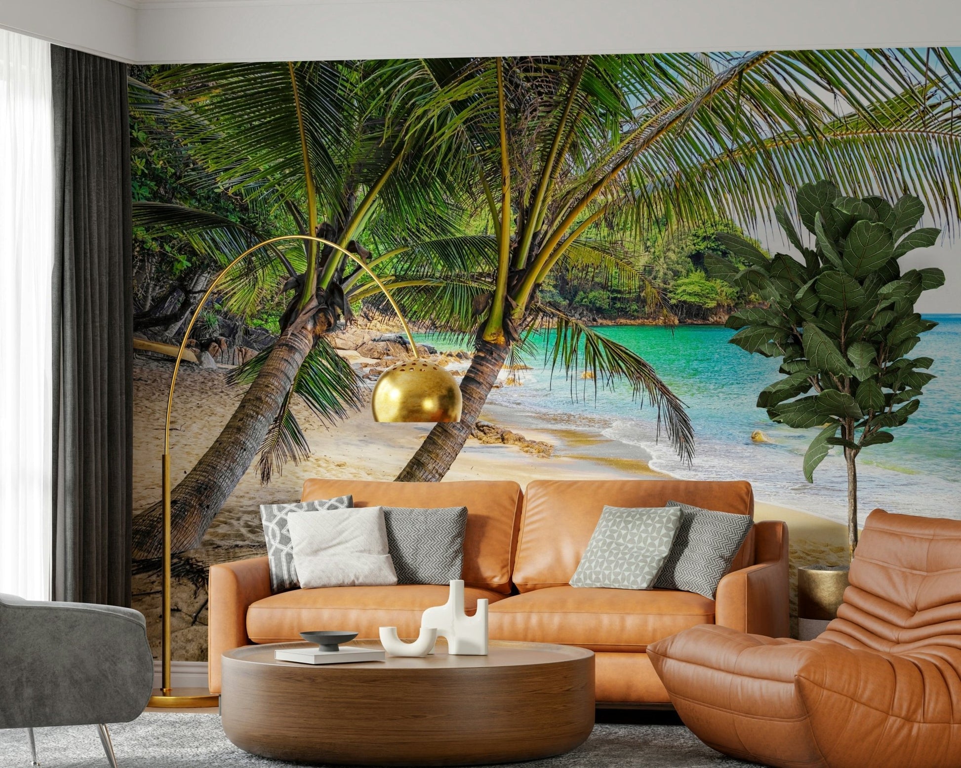 Tropical Beach Escape wallpaper mural of a turquoise beach behind a tan leather sofa and gold arc lamp in a living room