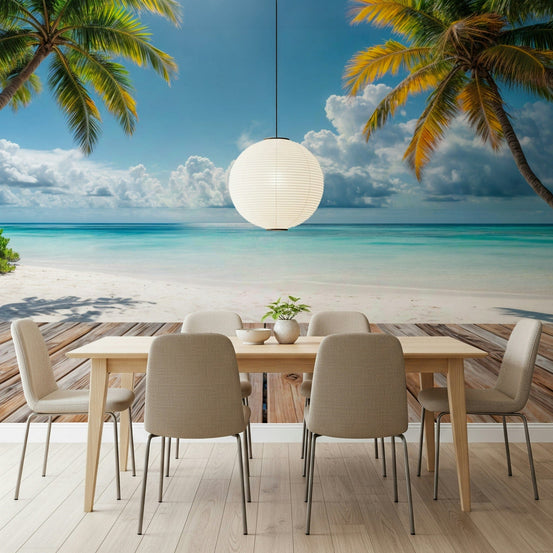 Tropical Beach View wallpaper mural with palms over turquoise sea behind a light wood dining table and beige chairs
