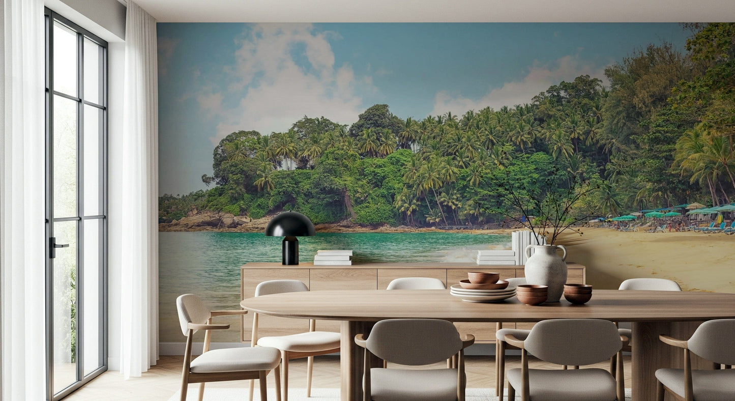 Tropical coastal wallpaper showing calm sea, forested shore, and open sky
