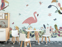 Tropical Bird wallpaper of flamingo and toucans in a kids playroom with white animal chairs and a toy kitchen