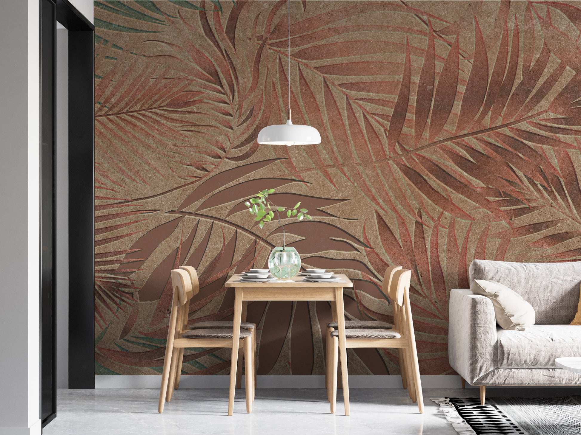 Tropical Copper Leaves wallpaper mural of rust palm fronds behind a light wood dining table and white sofa in a dining nook