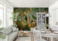 Tropical Explorers' Chart mural of birds and ferns in a cottage living room with floral sofa and white hutch