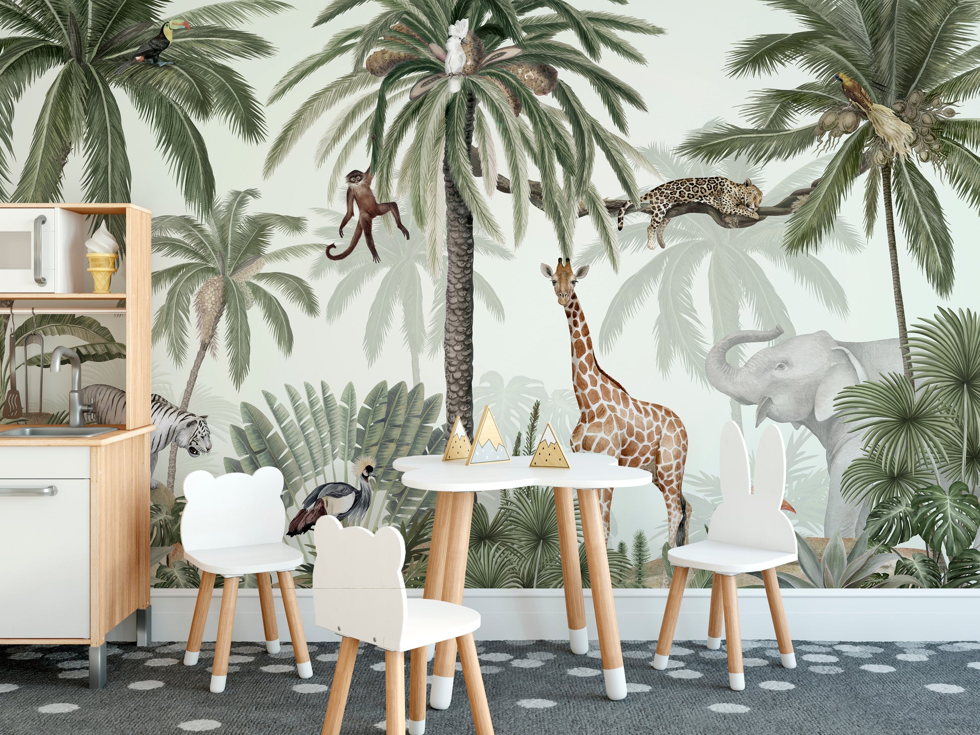 Tropical jive wallpaper mural with palms, giraffe, leopard and elephant above a cloud-shaped kids play table