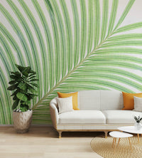 A contemporary living room with a large lime leaf wall mural.

