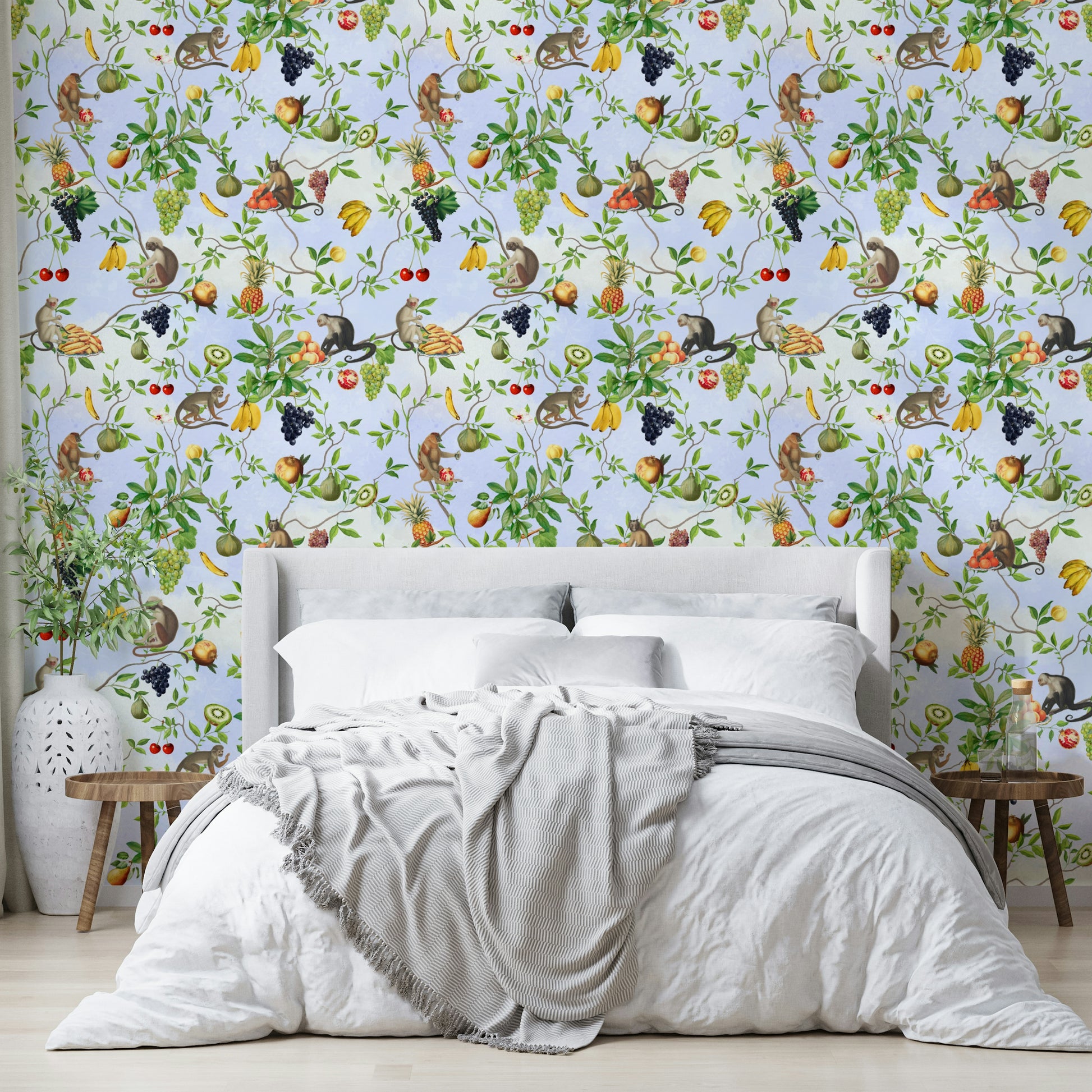 Vibrant jungle wallpaper with monkeys and colorful flora.

