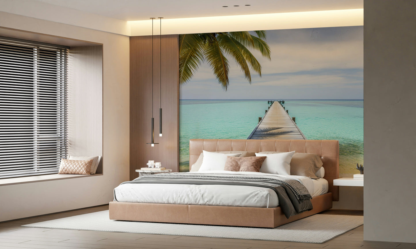 Tropical pier scene mural behind bed, sandy tones and teal water, clean minimal bedroom styling