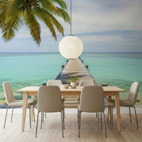 Coastal pier mural in home office, airy beach scene, blue water and warm light, modern wall decor