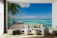 A wall mural depicting a serene, tropical scene.
