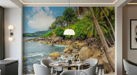Tropical Shores wallpaper mural of a sunny tropical coast behind a round dining table set for a meal in a dining room