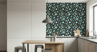 A seamless wallpaper of abstract turquoise mineral shapes reminiscent of polished agate.
