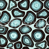 A bold mineral wallpaper with repeating turquoise geode clusters outlined in dark rings.